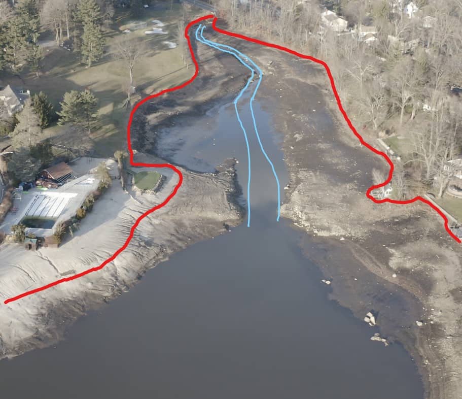 Image of a dried lake bed with a creek running down the middle. Lines are drawn to show the original shoreline and the creek bed.